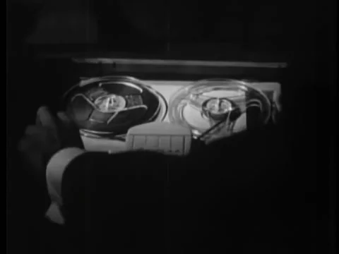 Man pulling out drawer and switching on tape recorder Stock-Footage 260256228