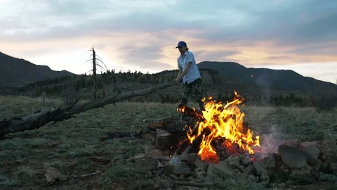 Man Pulling Pine Tree Near Fire For Firewood in Colorado Video stock 107634469