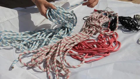 Man pulling a rope on a sailing boat, Sailor pulling rope on sailboat Stock Footage 170874588