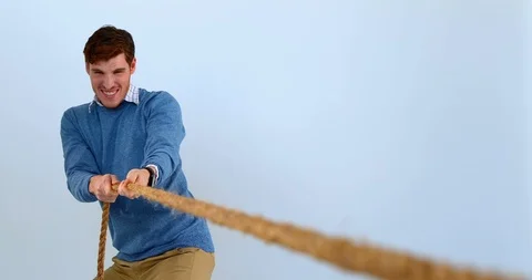 Man pulling a rope tug of war 4k | Stock Video | Pond5