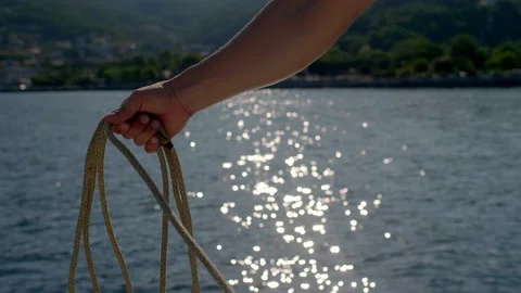 Man pulling sailboat lines in trieste gulf Video stock 233673284
