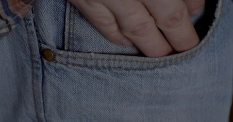 The man pulls the bitcoins out of his pocket Stock Footage 85689440