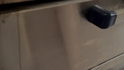 Man pulls bread out of the oven Stock Footage 111421307