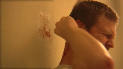 Man pulls device from head and bleeds. Stock Footage 99611330