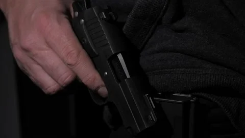 Man Pulls Gun From Holster Stock Footage 237028303