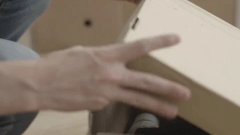 Man pulls a hammer out of the box. Man doing home renovations and pulls a hammer Stock Footage