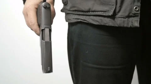 Man Pulls Handgun from the Back of His Pants in Slow Motion 库存影片 61271576