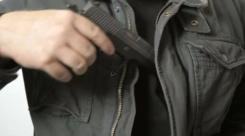 Man Pulls Handgun out of Coat in Slow Motion Stock Footage 61271453