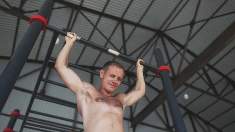 Man pulls himself up by his head Stock Footage 258654738