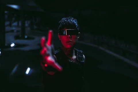 Man pulls his hand in the dark. The concept of the near future. Cyberpunk. Fotos de archivo