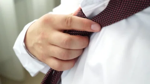 Man pulls up his tie Stock Footage 159882269