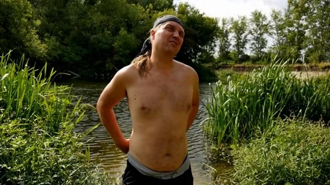 The man pulls the net to fish out of the water 스톡 동영상 82182470