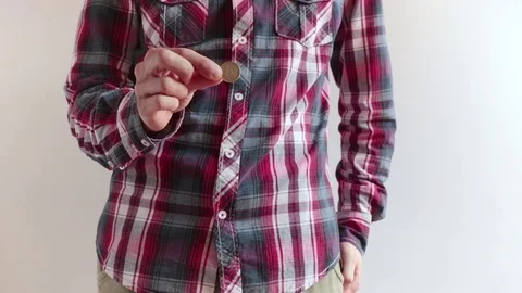 Man pulls out a coin of one euro and shows it Vidéo 76225159
