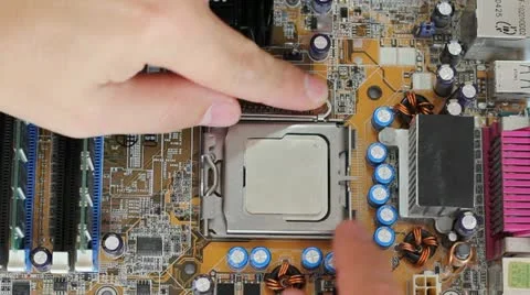Man pulls out a computer processor from the motherboard. Stock Footage 12387509