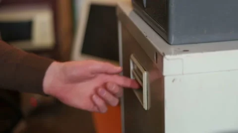 The man pulls out a file Stock Footage 62564209