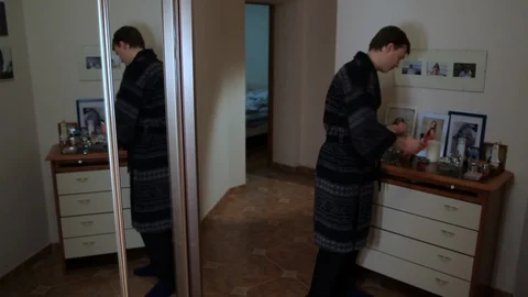 Man pulls out grey-haired hair Stock Footage 99800122