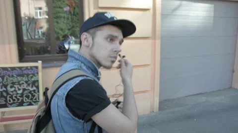 The man pulls out headphones. Stock Footage 51756054