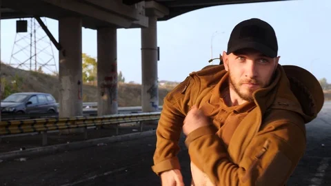 Man pulls out pistol moving forward Stock Footage 118403374