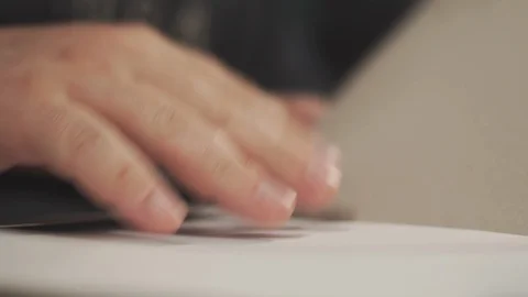 A man pulls out a sheet of paper from a folder. Video stock 113080139