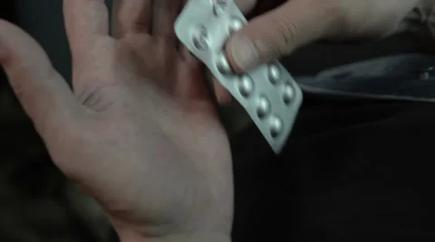 The man pulls out a tablet from the package. Stock Footage 51756328