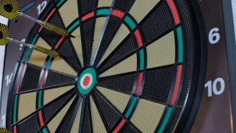Man pulls out yellow darts from the board Stock Footage 80713903