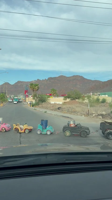 Man Pulls Parade of Cargo, Guaymas, Sonora, Mexico - 23 Aug 2025 Stock Footage 315353185