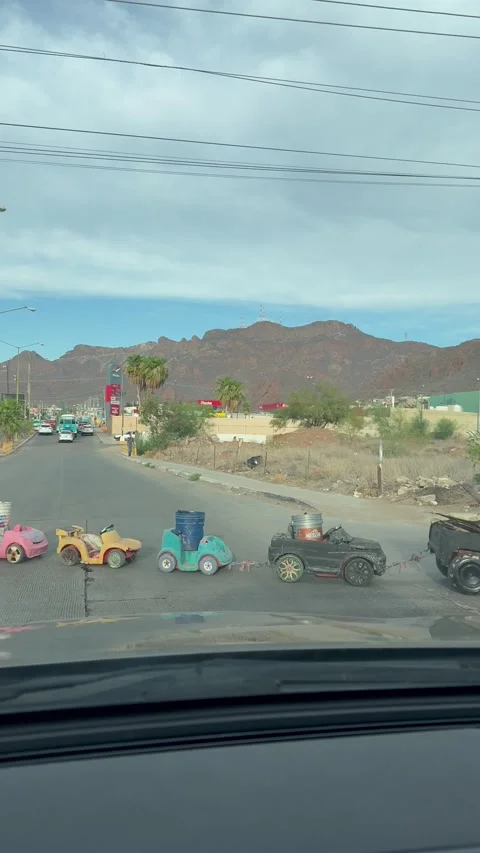 Man Pulls Parade of Cargo, Guaymas, Sonora, Mexico - 23 Aug 2025 Stock Footage 315353186