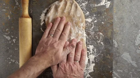 Man pulls the pastry paste for a paste. Video Stock Footage 85327780