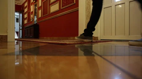 The man pulls a suitcase in hotel Stock Footage 60702256