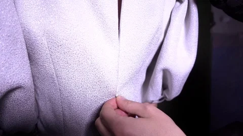 Man pulls  zip of Woman Back. Stock Footage 70899692