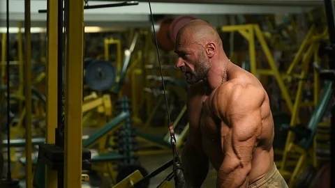 Man pumping up biceps muscles workout fitness and bodybuilding Video stock 119076848