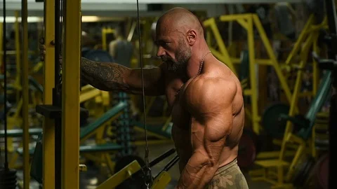 Man pumping up biceps muscles workout fitness and bodybuilding Video stock 119076908