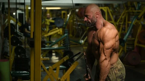 Man pumping up biceps muscles workout fitness and bodybuilding Video stock 119077145