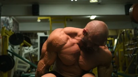 Man pumping up biceps muscles workout fitness and bodybuilding Video stock 119077239