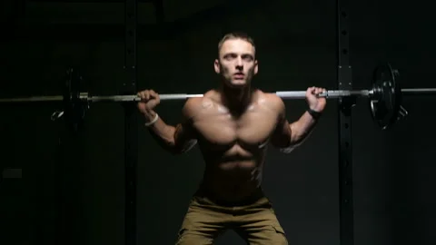 Man pumping up leg muscles Stock Footage 144557475