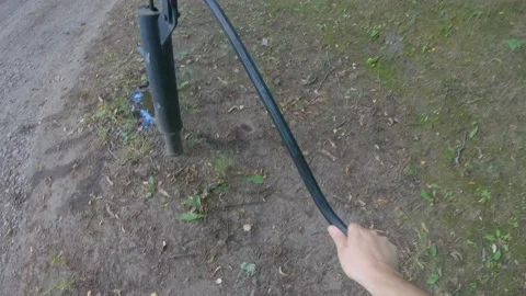 A Man is Pumping Water Desperately But It would not come Out of The Pump 4k60fps Stock Footage 135637154