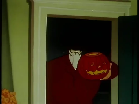 Man with pumpkin head standing in doorway Stock Footage 261022366