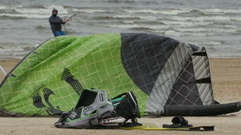 Man pumps air kite Stock Footage 116193473