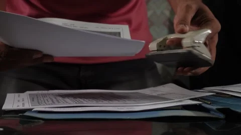 A man punched the document and put it aside Stock Footage 246542850
