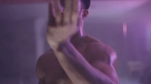 Man punching in the air while looking straight at the camera Stock Footage 279835638