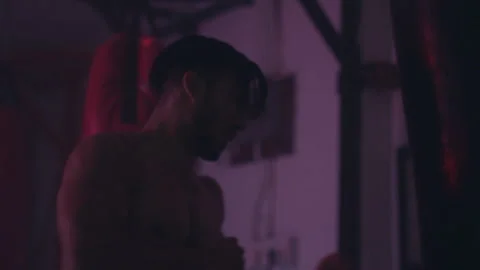 Man punching a punching bag Stock Footage 279840957