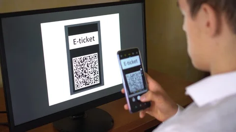A man purchases a E-Ticket with QR code online for the event, travel, trip Stock Footage 123649137