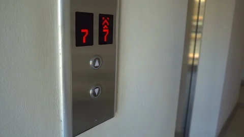 Man push the button to call an elevator and enter inside Stockbeeldmateriaal 88281353