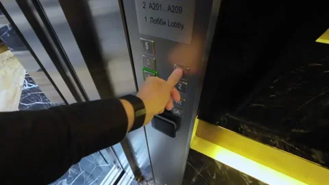 Man push the button in elevator. POV. Person in residential building. Stock Footage 235224560