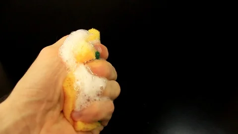 Man push dispenser and liquid detergent squeezed to sponge Stock Footage 86414111
