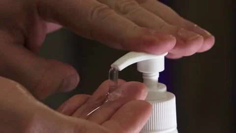 Man push dispenser and liquid soap squeezed out to hand Stock Footage 149916393