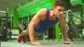 The man push up from the floor in the fitness center 4k or 4k+ Resolution