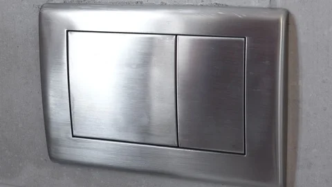 Man push flush button in modern restroom Stock Footage 112360434