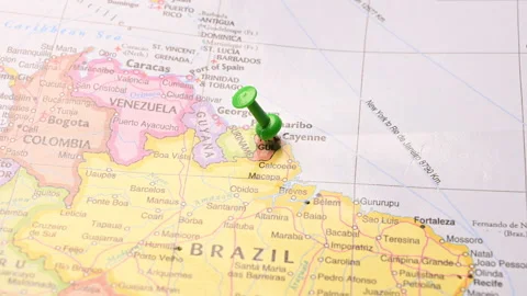 Man Push Pin Pointing On Cayenne On World Travel Map Stock Footage 328135159