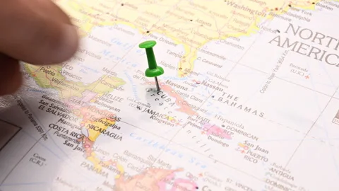 Man Push Pin Pointing On Cuba On World Travel Map Stock Footage 328103936